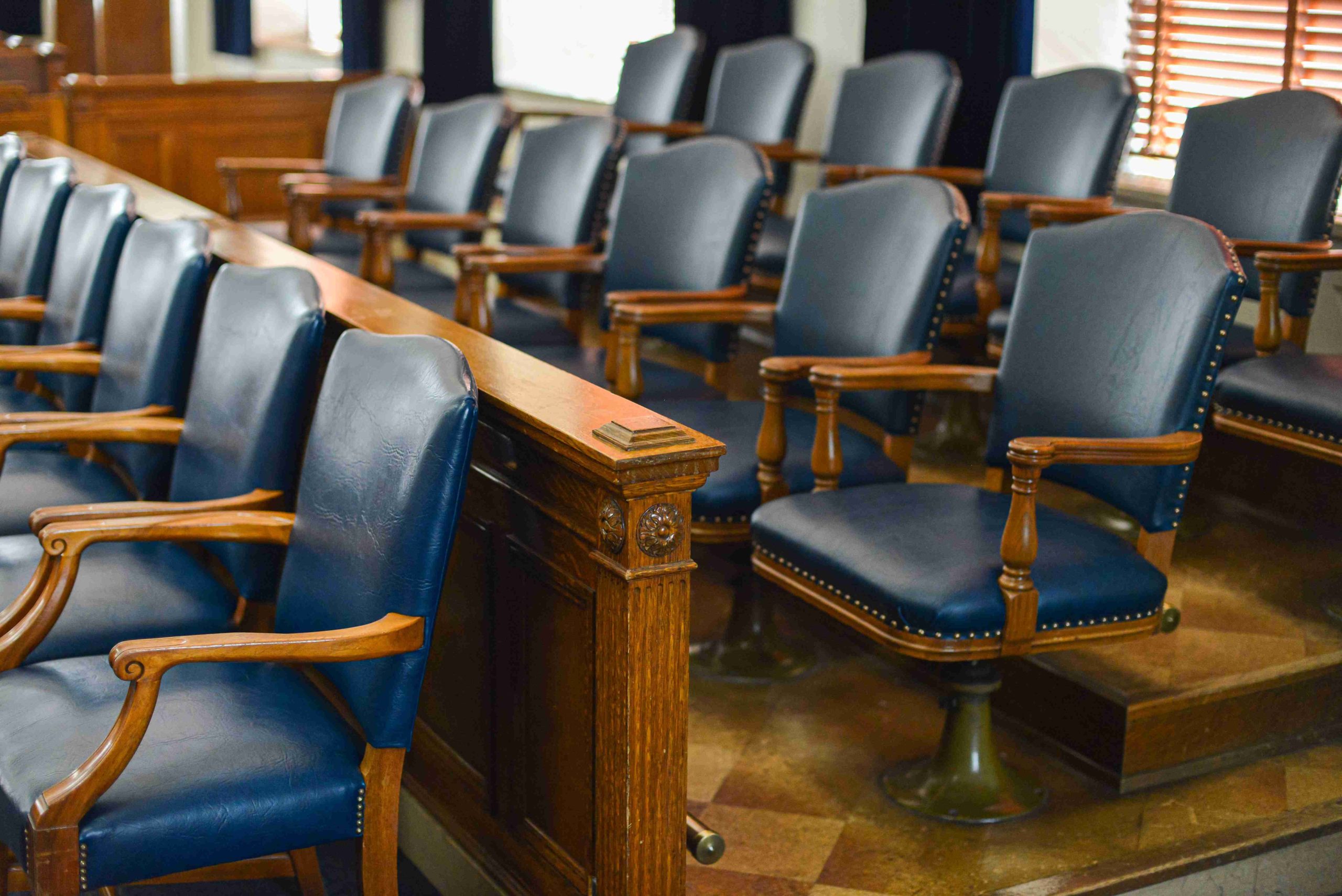 empty-jury-box-with-blue-leather-chairs-and-window-2023-11-27-05-26-26-utc-1-scaled.jpg